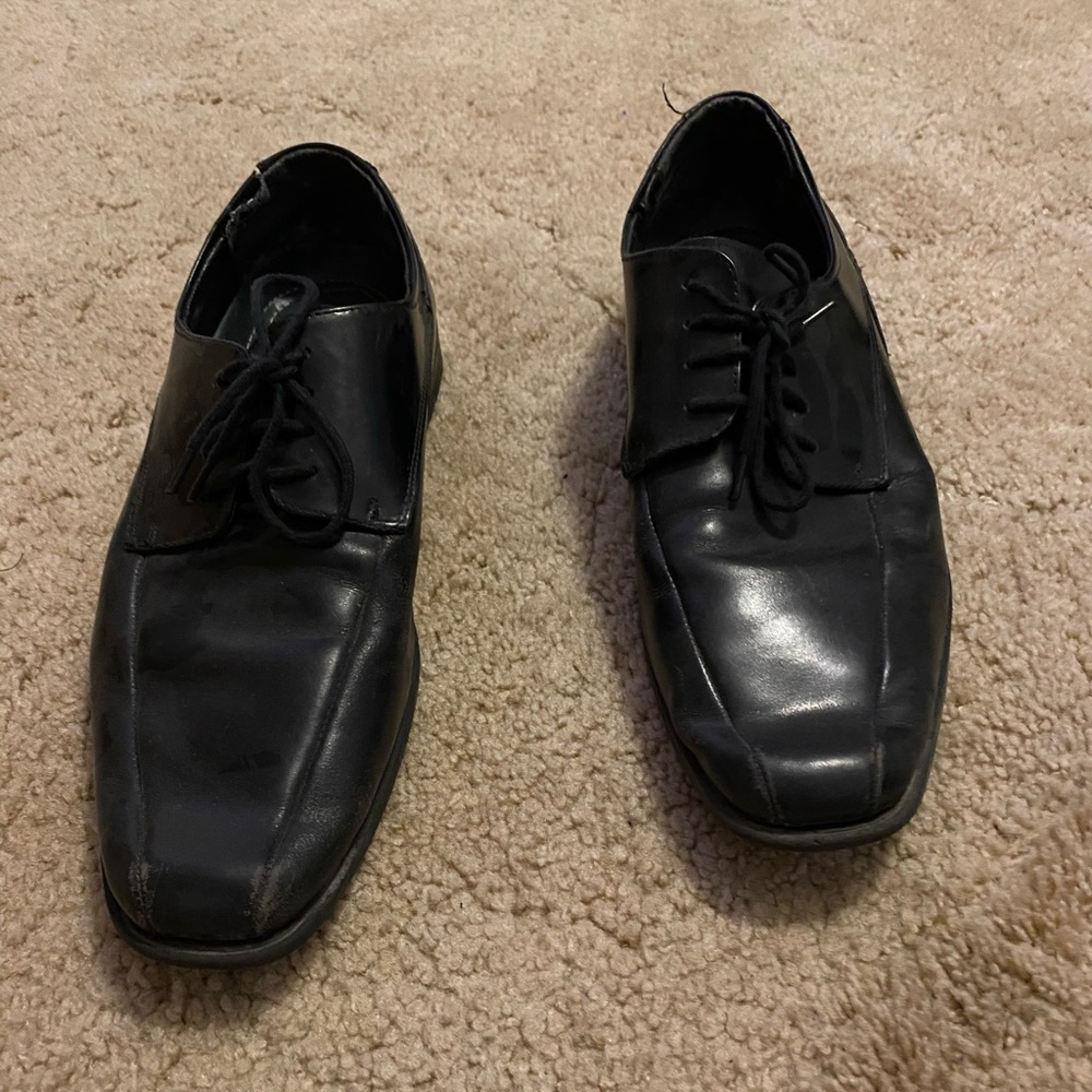 Black leather dress shoes. Well worn